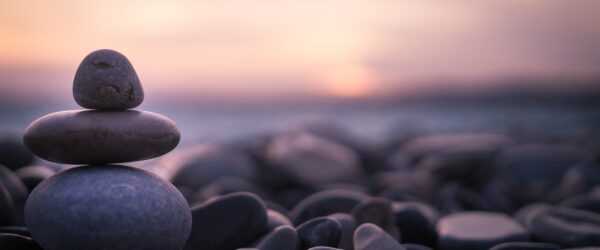 Sunset on pebbles in Nice, France.